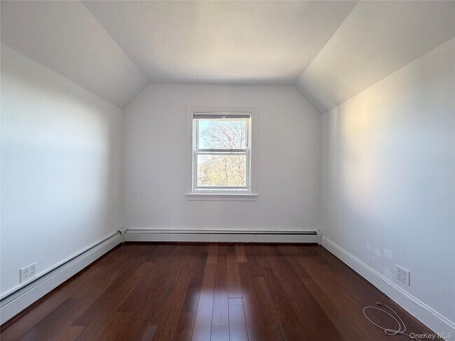 Building Photo - 210-10 56th Ave