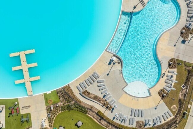 Building Photo - Live the Sunterra Lifestyle: Lagoon, Pool & More