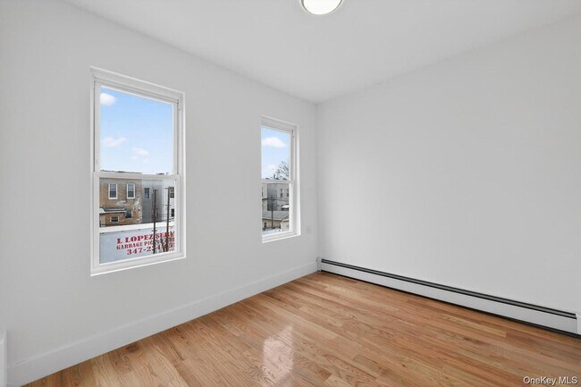 Building Photo - 25-61 99th St