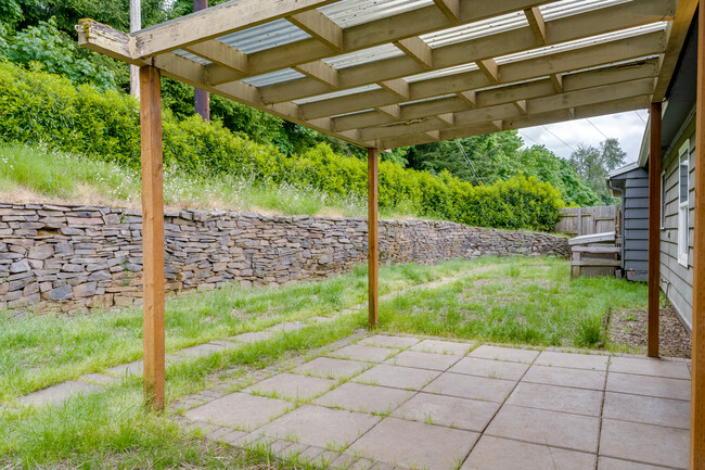 Expansive stone wall adds to the natural ambience - 211 Farview Drive