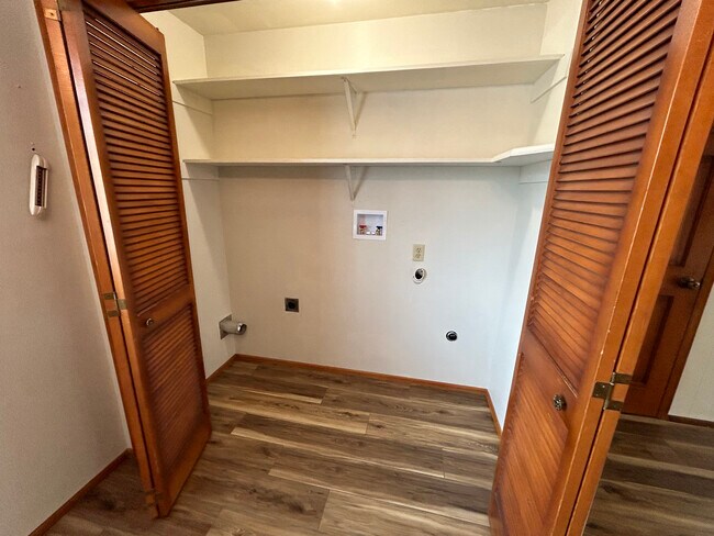 Washer/Dryer hookups with wood bifold doors - 8519 49th St W
