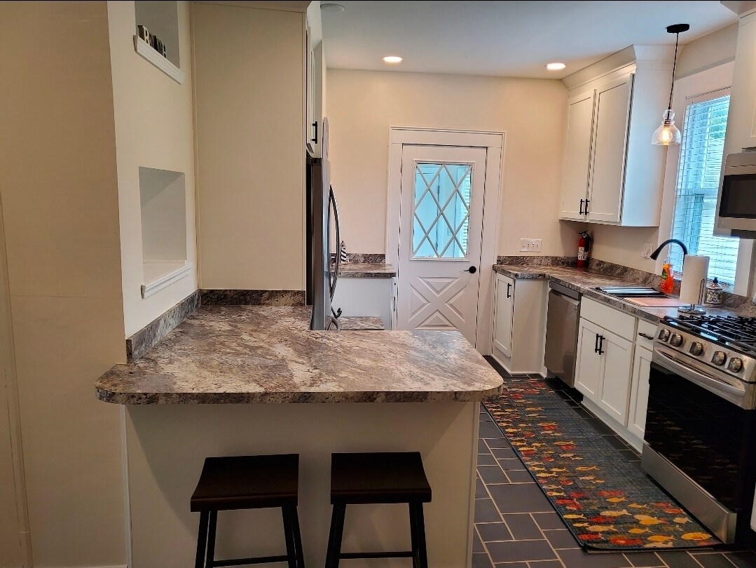 Kitchen with Bar Stools - 1614 Michigan Blvd