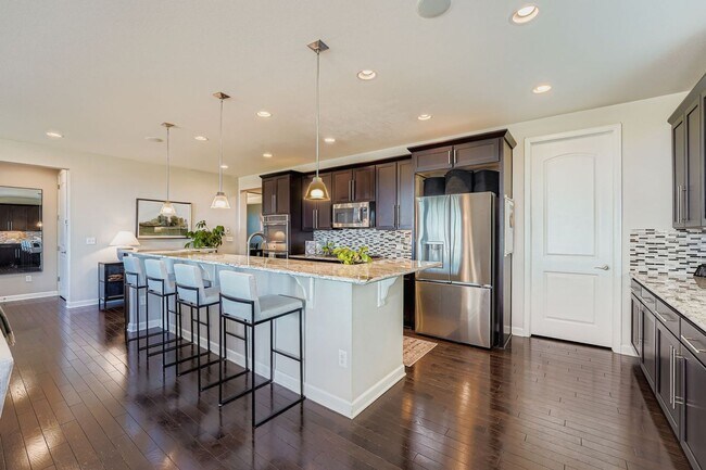 Building Photo - Beautifully maintained 5-bedroom home with a large finished basement, club access, and top-rated ...