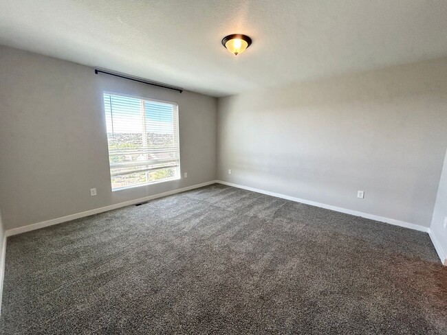 Building Photo - Impressive 4 Bedroom Townhome Nestled in M...