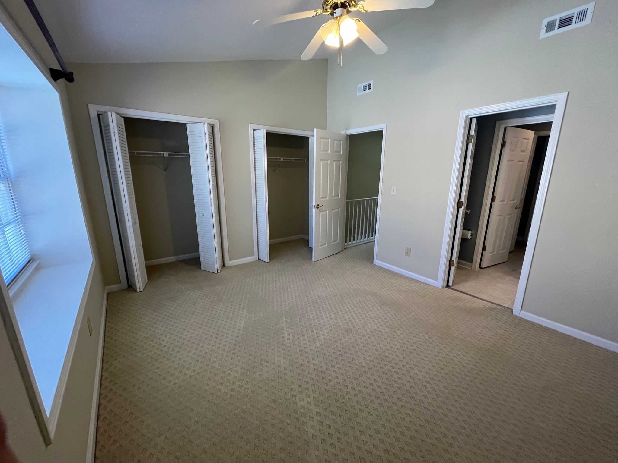 Spacious master bedroom with vaulted ceiling and large closet space - 830 44th Ave N