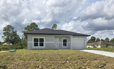 Building Photo - Brand New 2/2/1-South Lehigh Acres