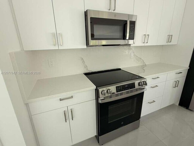 Building Photo - 8636 100th Ct