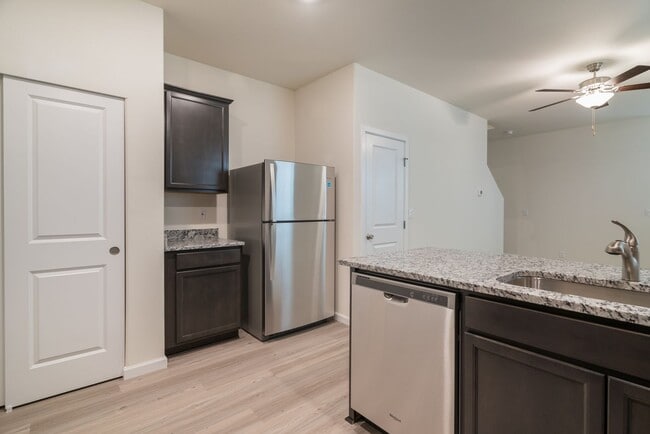 Building Photo - Super clean & spacious 4-bdrm/3-bath townhome in NE—Attached garage, great location