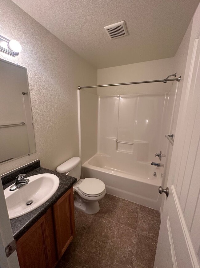 Building Photo - 3 BEDROOM, 2.5 BATHROOM TWINHOME WITH 2 CAR ATTACHED GARAGE