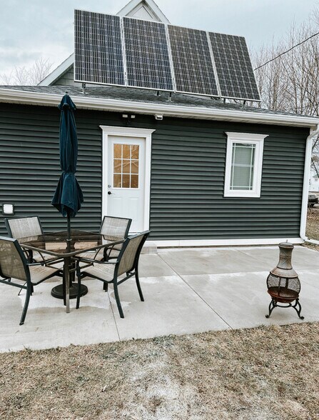 We have a back patio with a table, chairs and a grill. - 624 Park St