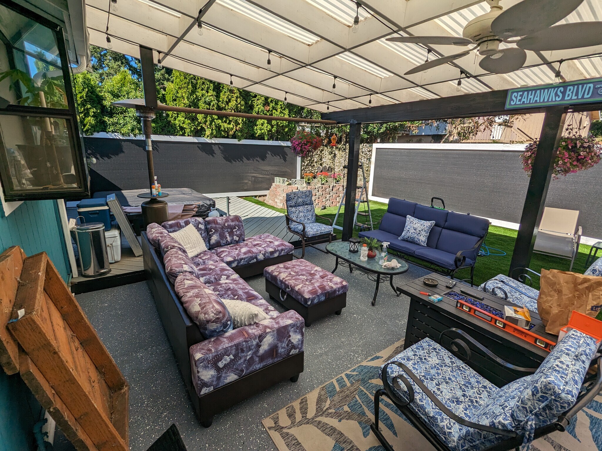 Backyard patio covered with artificial grass - 24028 25th Ave S