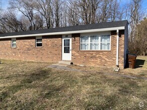 Building Photo - Welcome to this charming two-bedroom, one-...