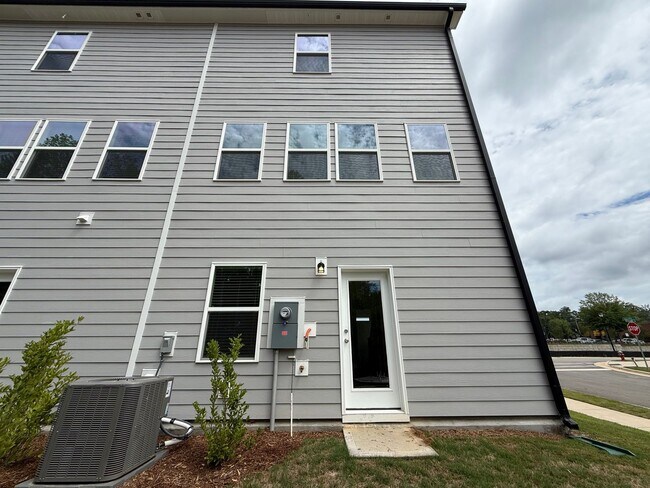 Building Photo - Stunning End Unit New Construction 3BD, 3....
