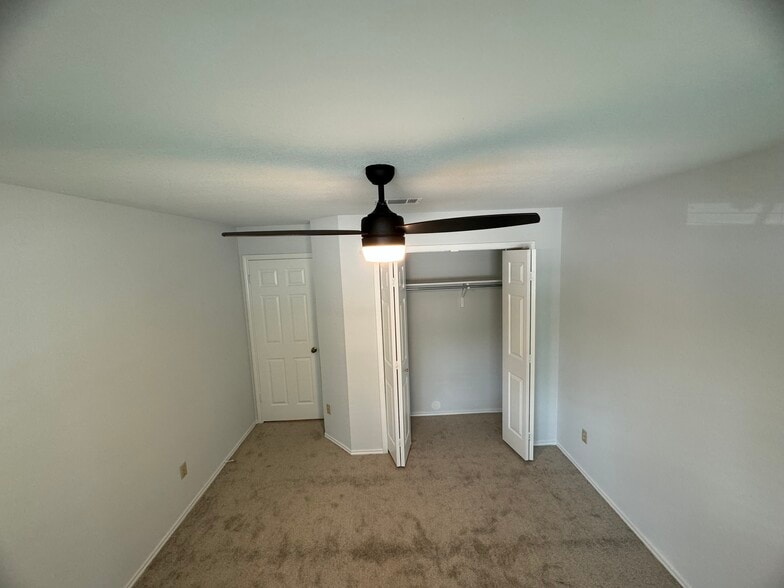 Guest bedroom and closet - 736 Patchway Ln