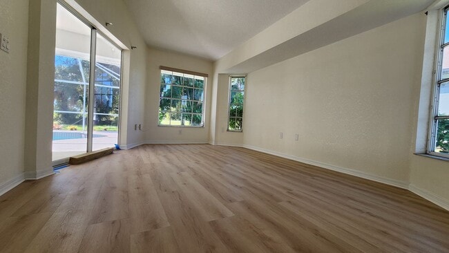 Building Photo - Fresh Paint, New Floors, and a Heated Pool...