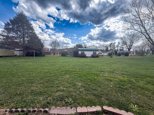 Building Photo - Spacious 3-Bedroom Home with Huge Yard, Covered Porches & Storage Building