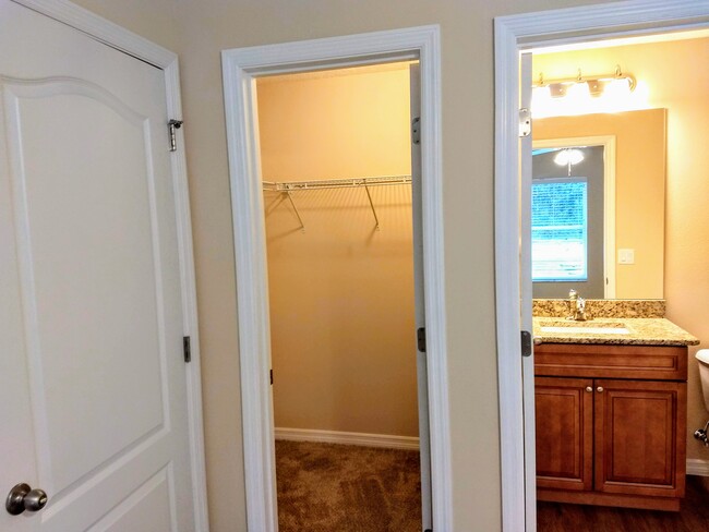 Main bedroom walk-in closet and bathroom - 9356 N Peachtree Way