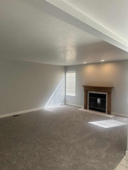 Family room with fireplace - 9228 S Stone Point Pl