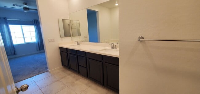 Building Photo - Beautiful townhome features a bright, open-concept layout