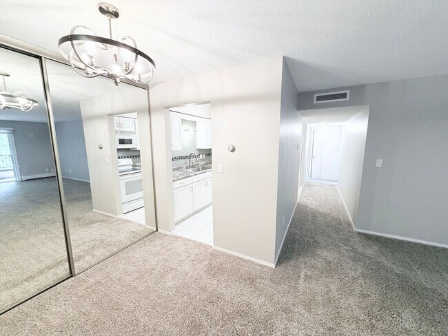 Building Photo - Large 1BR Condo with Patio, Heated Parking, Pool, Sauna & Tennis Courts!