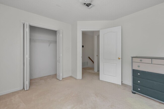 Building Photo - Spacious 3BR Retreat with Soaring Ceilings & Screened Porch