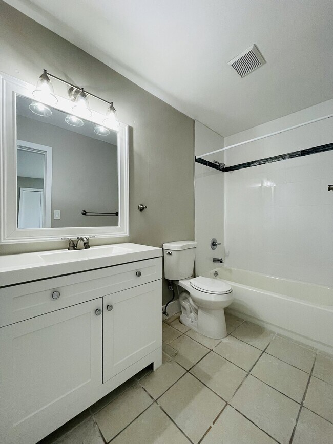 Building Photo - Updated 2-bedroom waterfront duplex with walk-in closets, enclosed Florida room, and canal views ...