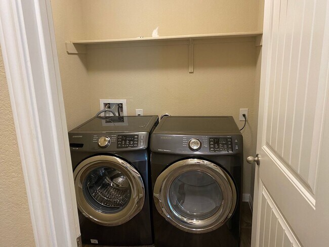 Building Photo - Three Bedroom, Two Bath, Two Car Garage, Washer and Dryer are included.