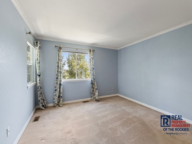 Building Photo - Fort Collins Townhouse with Vaulted Ceilin...