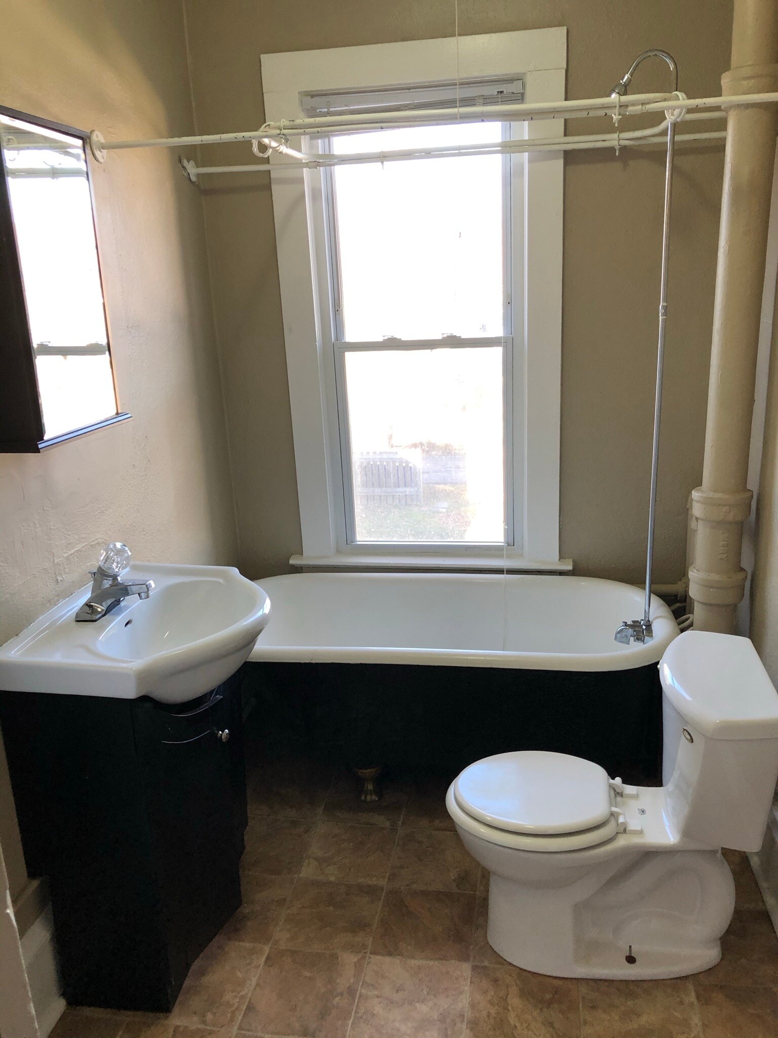 Full size clawfoot tub and shower - 1749 Wordsworth Ave