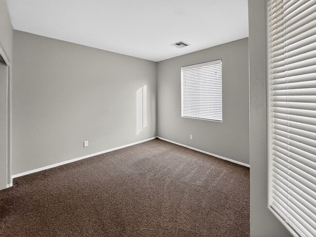 Building Photo - Single-level 4 bed, 2 bath home with tandem 3-car garage and RV gate.