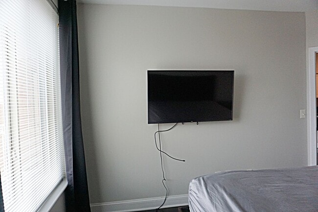 Building Photo - A Modern Living of Top-Level Unit in the C...