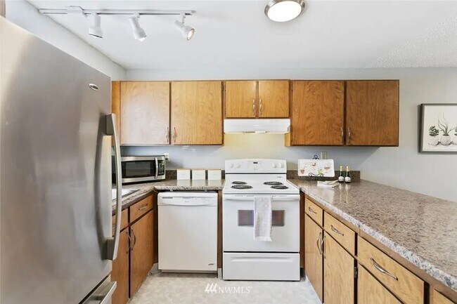 Kitchen has been updated with white paint - 8017 196th St SW