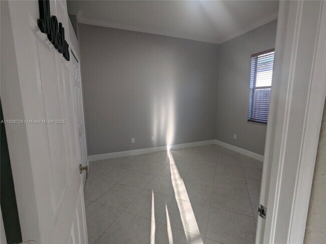 Building Photo - Northwest 91st Court, Hialeah Gardens, FL 33018 - 3 BR 1 BA single-family home