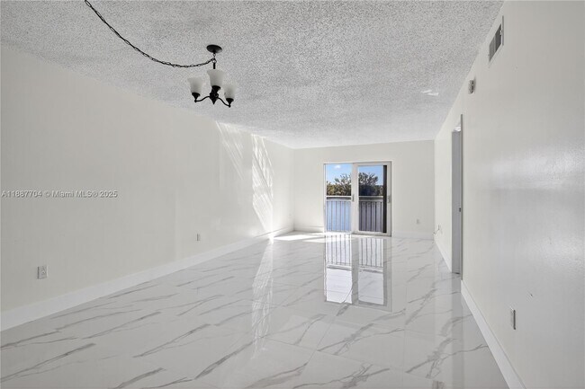 Building Photo - 9915 W Okeechobee Rd