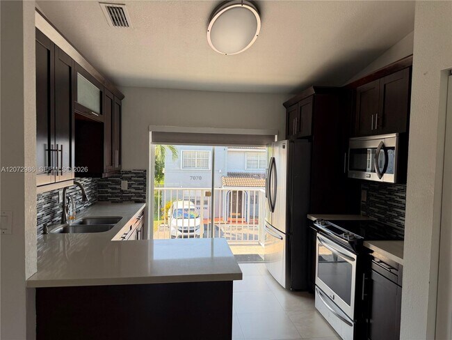 Building Photo - 7040 NW 173rd Dr