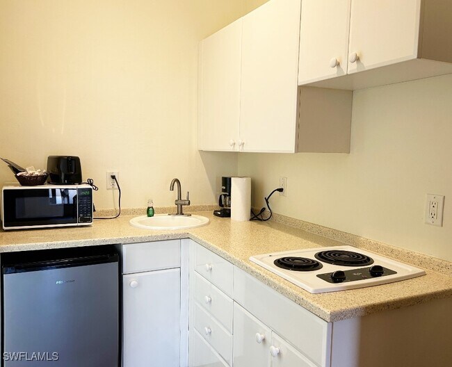 Building Photo - 25000 Tamiami Trl E