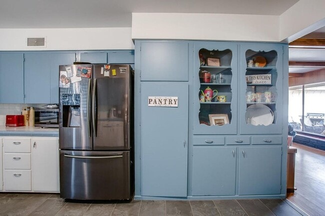 Building Photo - Spacious 4-Bedroom Home with Dual Living Areas