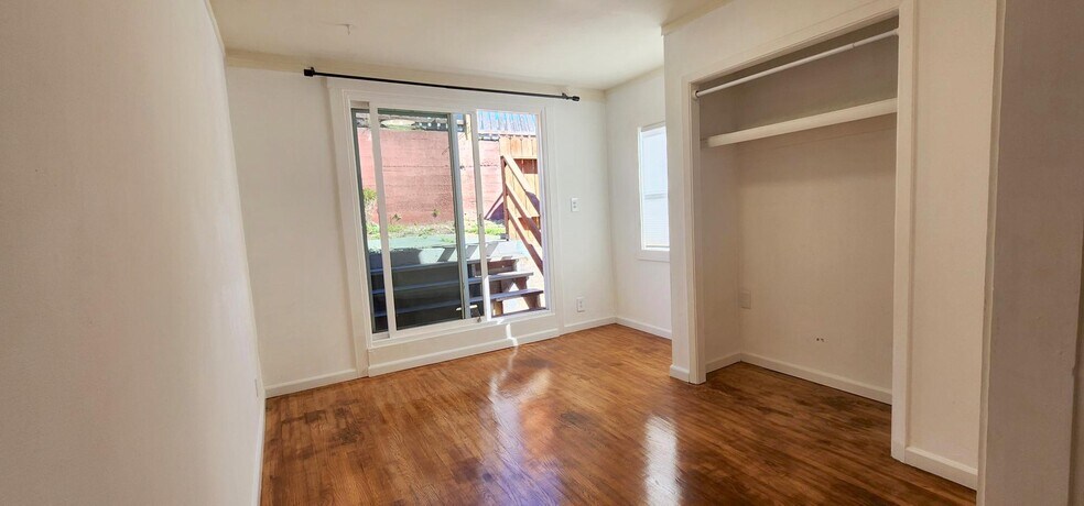 Master Bedroom adjoining office: 11'9" x 10'8" looking out through the sliding glass doors into the - 245 Concord St