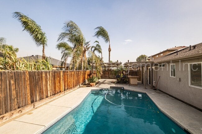 Building Photo - 3 Bedroom/2 Bath with a Pool and Solar - $...