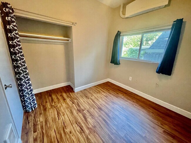 Building Photo - Prime Location! Modern 2BD/1 BA with A/C & EV Charging Steps from Mississippi