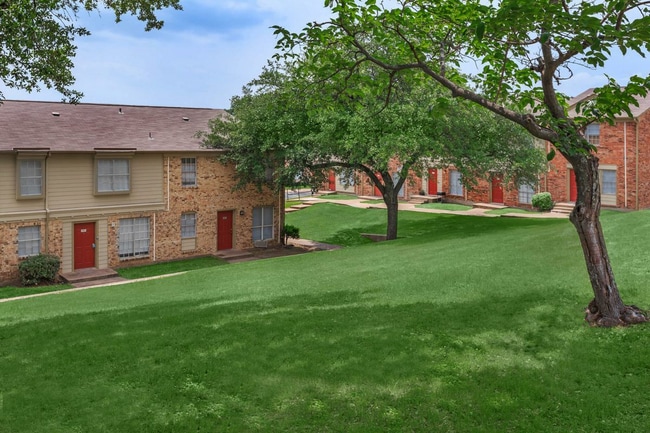 Colonial-style architecture with brick façades and timeless design - Vista Montana Apartments
