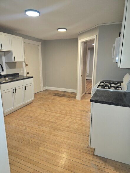 New kitchen, newly finished wood floors throughout. - 347 Pearl St