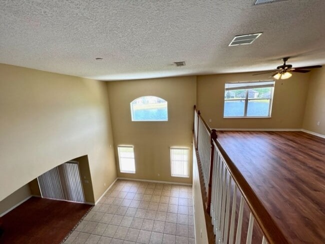 Building Photo - EAGLE CREEK LAKE NONA! WELCOME HOME! Beautiful water views! Spacious 2 story-3 bedroom 2.5 bath h...