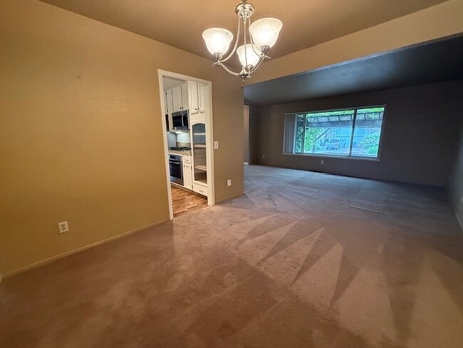 Building Photo - OPEN HOUSE this Wednesday 5pm-6:30pm - Private Redwood Setting | 4BR Home with Family Room, Bar &...