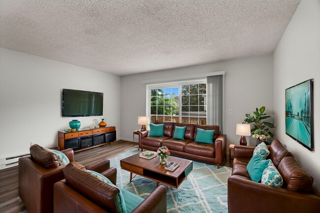 Experience the elegance and comfort of this bright and inviting living space. - University Crossing Apartments
