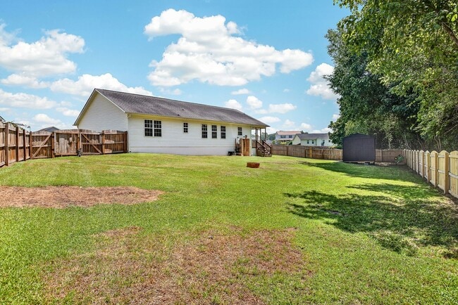 Building Photo - Charming Cow Horn Village Home with Outdoor Shower & Fenced Backyard