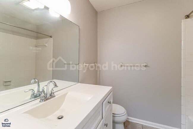 Building Photo - Move-In Ready Gem with Massive Fenced Yard & Private Deck!