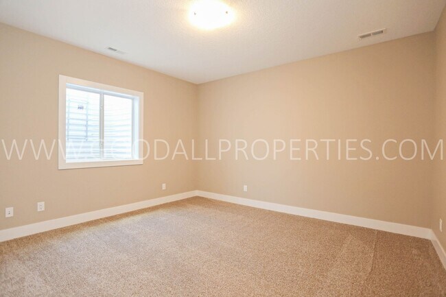 Building Photo - 4-Bedroom Ranch Home in Clive with Finished Basement & 3-Car Garage