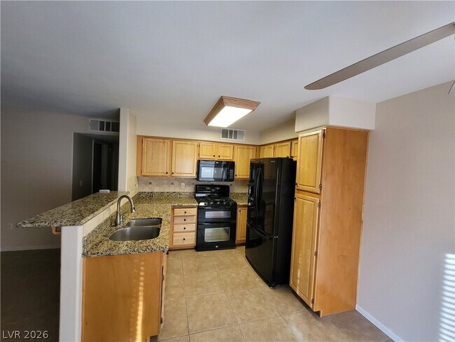 Building Photo - 5710 E Tropicana Ave