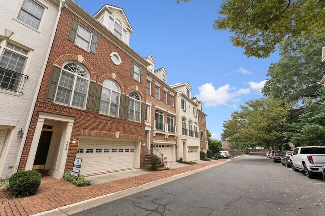 Building Photo - Discover this stunning four-level townhous...